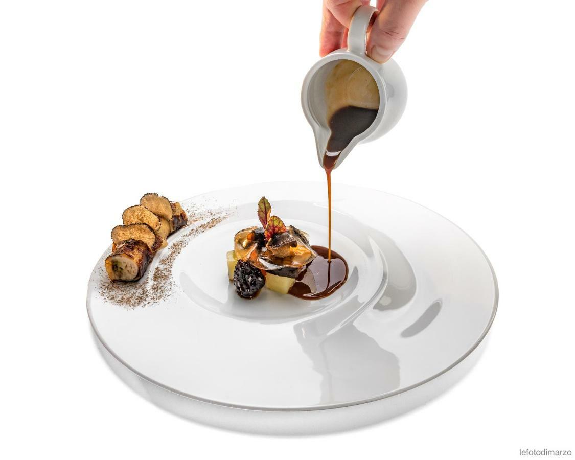Grand Hotel Sitea Torino Esterno foto A chocolate sauce being poured over a dessert