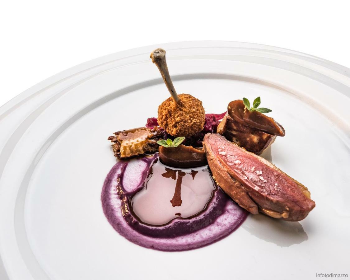 Grand Hotel Sitea Torino Esterno foto A duck dish